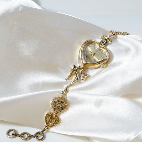 Retro Heart-shaped Bracelet Watch With A Golden Bow And Flower Design A Stylish Womens Timepiece